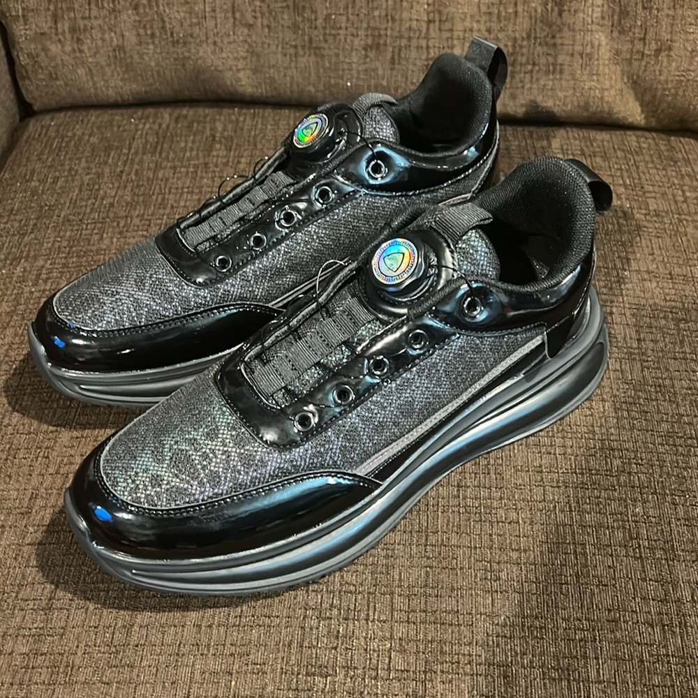 Stylish Black and Patent Leather Trim Sneakers with unique twist knob laces. - Picture 2 of 9